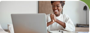 Great Loan Rates Image of woman smiling at computer